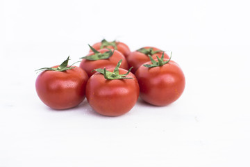Ripe tomatoes of bright red color isolated on white