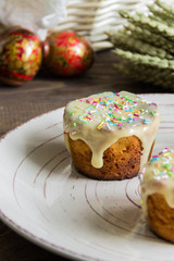 Traditional Easter cake with glace icing and painted easter eggs.Rustic style. Easter arrangement
