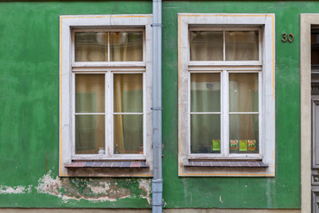 Fototapeta na wymiar Old windows in the tenement house