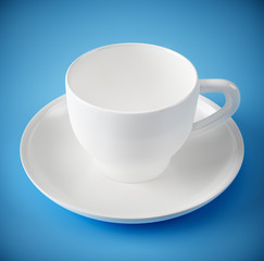 white cup on blue background