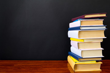 Stack of books on black background