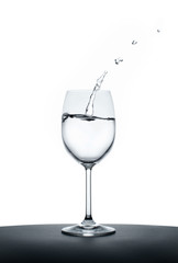 splashing water wave in the wine glass