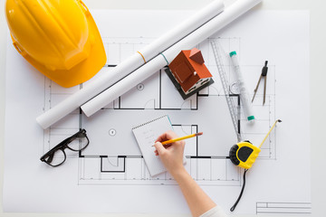 close up of architect hand with blueprint