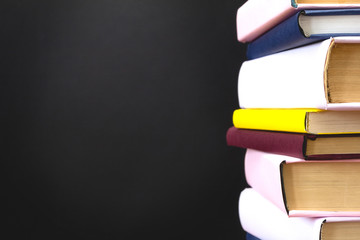 Stack of books on black background