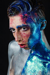 Crazy young androgyne man with face art. SPACEMAN. Freak person. Sperm on face. Tinsel creative...