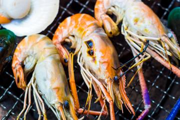 Grilled shrimp close up on fire