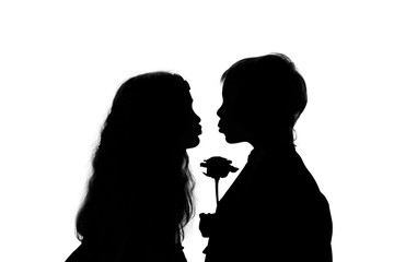 Love concept. Silhouette kissing boy and girl.