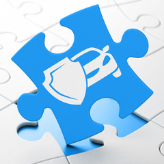 Insurance concept: Car And Shield on puzzle background