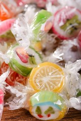 Pile of candies with fruit motifs in cellophane