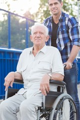 Smiling man on wheelchair
