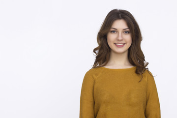 Obraz premium Pretty girl in orange sweater