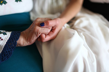 The palms of bride and her grandmother