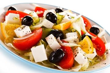 Greek salad on white background