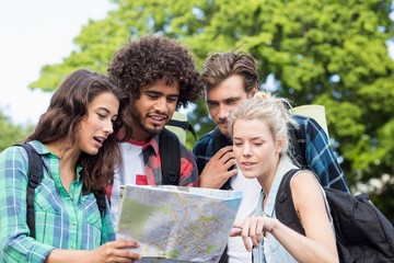 Friends looking at map