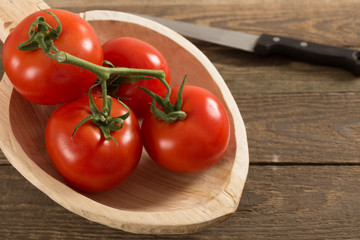 Tomatoes on rustic background