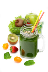 Green detox smoothies and ingredients on a white background