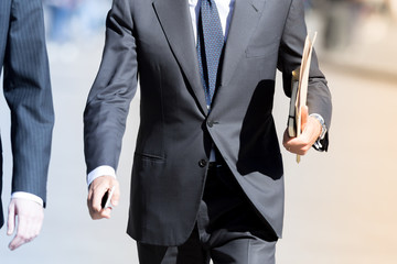 Businessman walking outdoor in the street