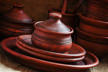 Ethnic pottery, vintage wooden background, selective focus