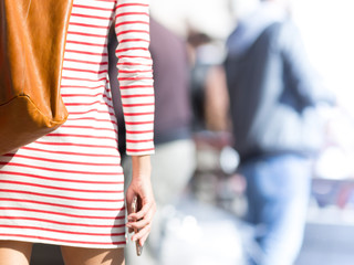 Naklejka premium Sexy lady shopping outdoor in the street