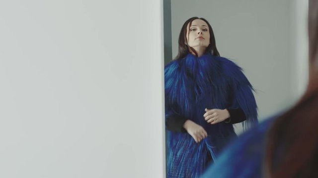 young woman wearing a fur coat