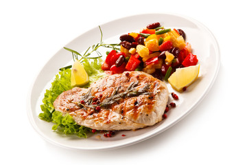 Grilled steak and vegetables on white background 