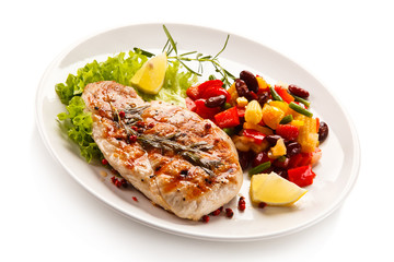 Grilled steak and vegetables on white background 