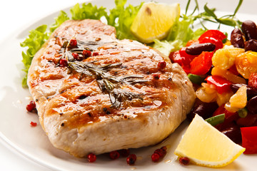 Grilled steak and vegetables on white background 