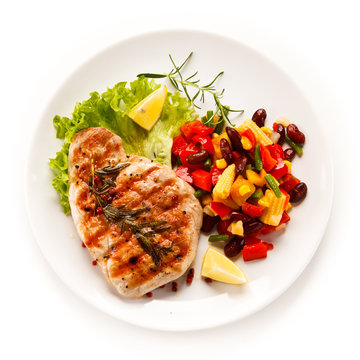 Grilled steak and vegetables on white background 