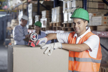 Worker In Warehouse Preparing Goods For shipping