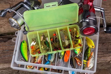 Selbstklebende Fototapeten fishing tackles and fishing baits in box © sytnik