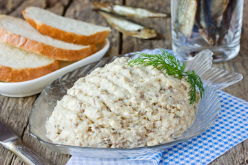 Forshmak paste from herring with butter on old wooden table