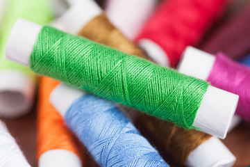 colorful yarn and neeldes for sewing