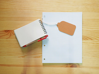 notebook, tag, paper with wood background