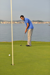 Young man playing golf
