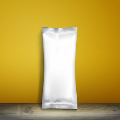 Blank white packaging. Sample package. Blank template for design. Net packaging is on shelf. Mockup Foil Food Snack pack, packaging, wrapper. Plastic Pack Template for design and branding. yellow wall