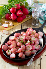 Rice fried with garlic in oil in a rustic style