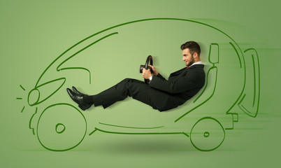 Fototapeta premium Man drives an eco friendy electric hand drawn car