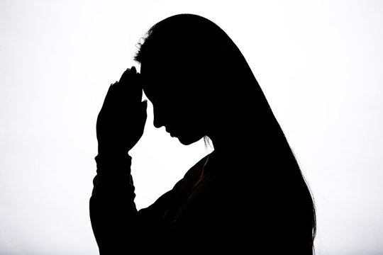 Woman praying silhouette