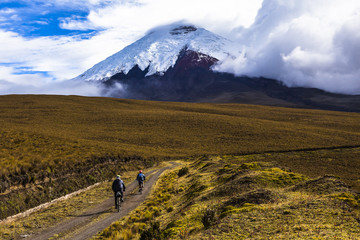 Two mountain bikers riding in the Cotopaxi National Park