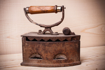 Fototapeta na wymiar antique iron , Old iron , Old iron on wood wall