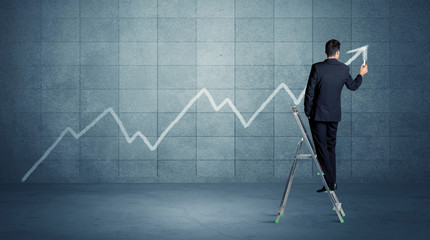 Fototapeta premium Man drawing line from ladder