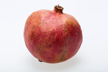 red pomegranate isolated on a white background