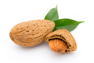 Almonds with leaves isolated on white background