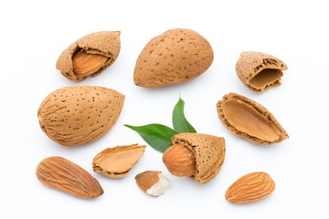 Almonds with leaves isolated on white background