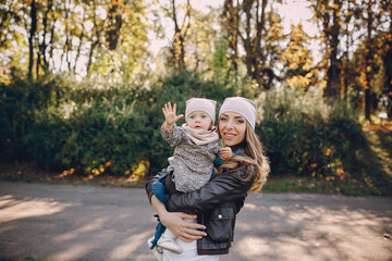 Obraz premium young family walking in the park