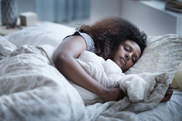 Woman sleeping in bed
