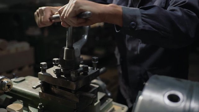 worker tightening bolts