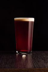  The beer red ale. The dark background.