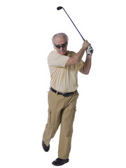 man hitting a golf ball