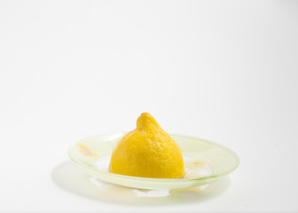 lemon half on sourcer white background